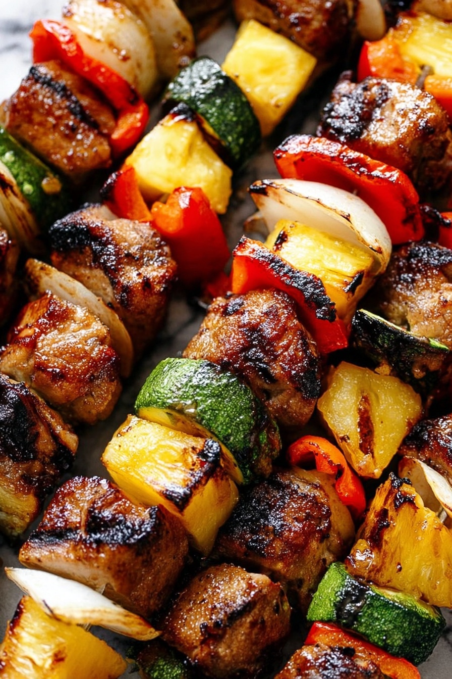 The image shows close-up grilled kebabs with several layers on each skewer. Each skewer has chunks of browned, grilled meat with dark grill marks, slices of red bell pepper, green zucchini rounds, pieces of yellow pineapple, and white onion wedges. The skewers are arranged closely on a grill or cooking surface. The colors are warm and vibrant with a mix of golden browns, bright reds, deep greens, fresh yellow, and white, showing a fresh and cooked texture. The background is a white marbled texture. Photo taken with an iphone --ar 2:3 --v 7