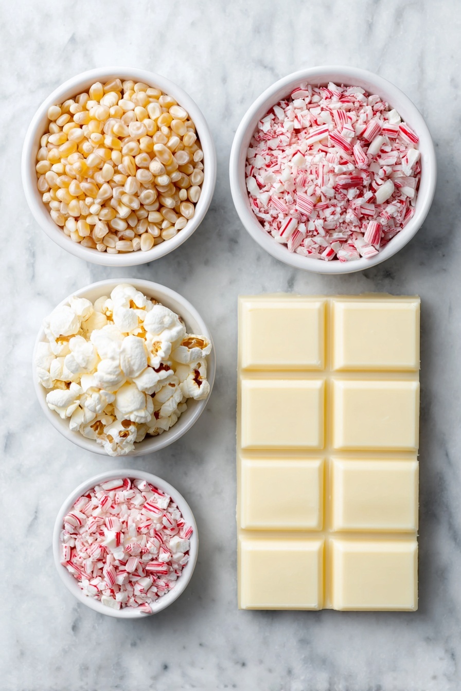 Flat lay of a small mound of natural popcorn kernels, a neat pile of smooth white chocolate wafers, and a small white ceramic bowl filled with finely crushed bright red-and-white candy cane pieces, all arranged in perfect symmetry and balanced proportions, placed on a clean white marble surface, soft natural light, photo taken with an iPhone, professional food photography style, fresh ingredients, white ceramic bowls, no bottles, no duplicates, no utensils, no packaging --ar 2:3 --v 7 --p m7354615311229779997