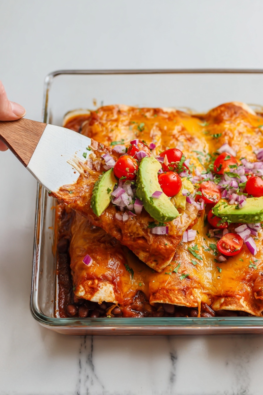 Two rolled enchiladas with a melted orange cheese layer on top sit in a clear glass baking dish. The enchiladas are covered with small chopped red onions, slices of red cherry tomatoes, and chunks of green avocado on top. A woman's hand holding a wooden and white spatula is lifting one enchilada slightly, showing the inside filled with a red sauce and some dark beans. The dish sits on a white marbled surface with a plain light background. photo taken with an iphone --ar 2:3 --v 7